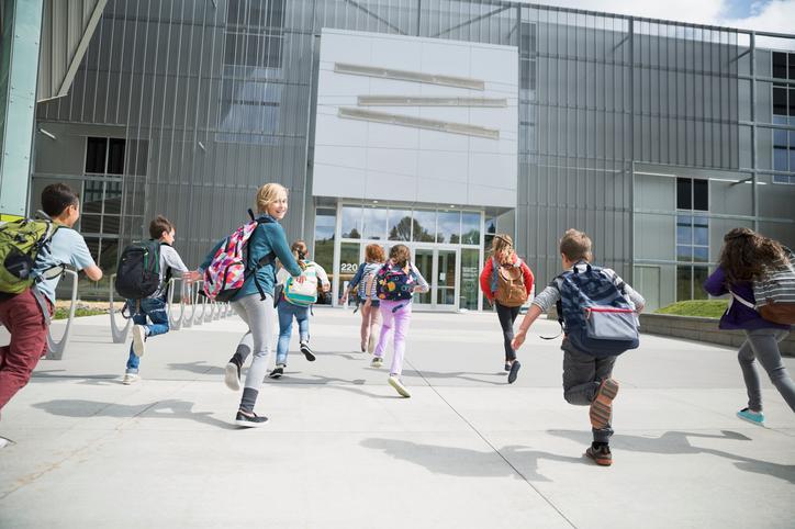 kids running towards school